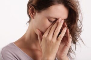 Woman struggling with sinus headache